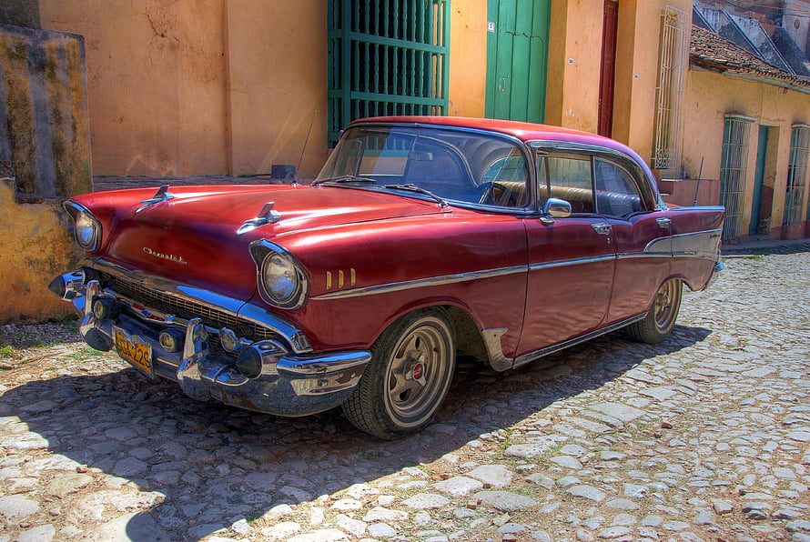 Classic Red Chevrolet Bel Air Parked on Cobblestone Street in Havana Cuba HD wallpaper