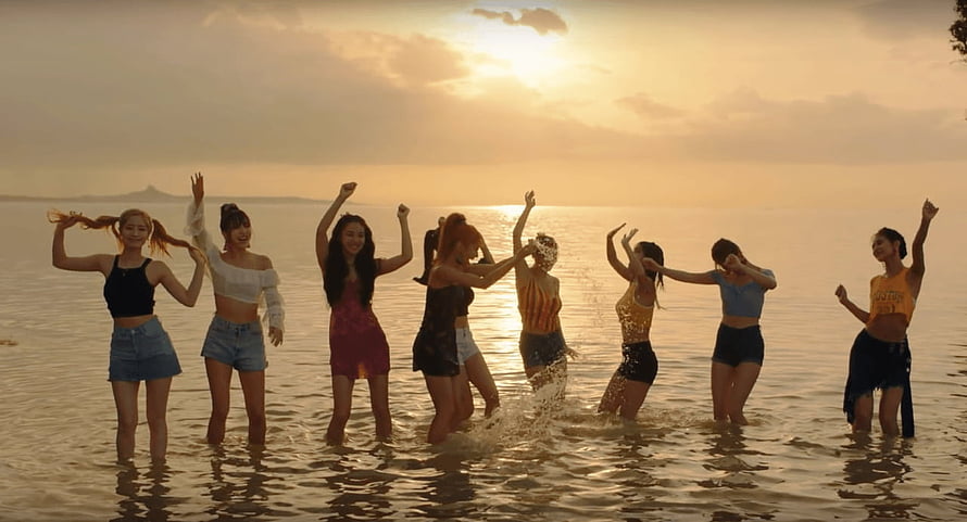 Twice K-Pop Group Dancing in Shallow Water at Golden Sunset Beach HD wallpaper