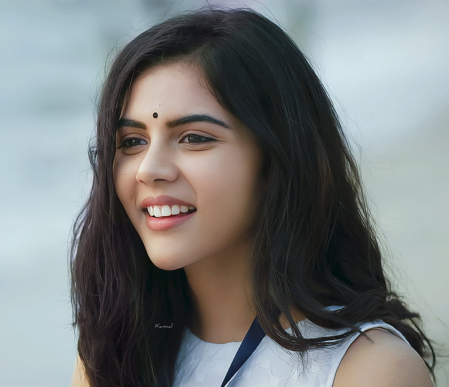 Kalyani Priyadarshan smiling portrait with long dark hair and bindi HD wallpaper