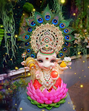 Adorned Baby Ganesha Idol on Lotus with Peacock Crown and Jewels HD phone wallpaper