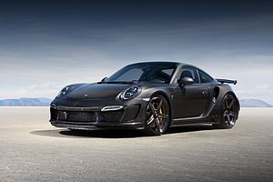 Porsche 911 Turbo S Carbon Edition in Matte Black on Open Desert Terrain HD wallpaper