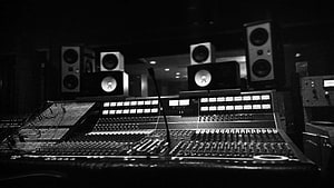 Professional Recording Studio Control Room with Large Mixing Console and Monitor Speakers HD wallpaper