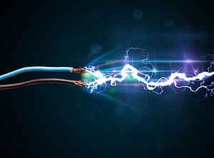 Electric Arc Discharge Between Exposed Wires on Dark Background HD wallpaper