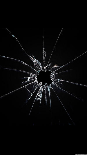 Shattered Glass Impact on Black Background with Radiating Fracture Lines HD phone wallpaper