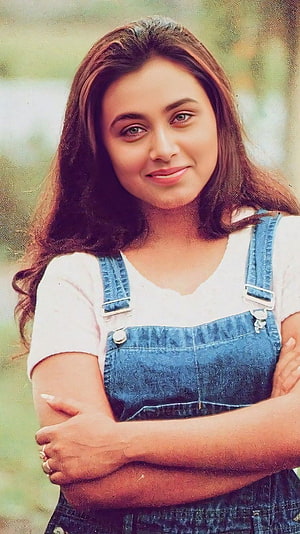 Rani Mukherjee in Denim Overalls and White T-Shirt with Arms Crossed HD phone wallpaper