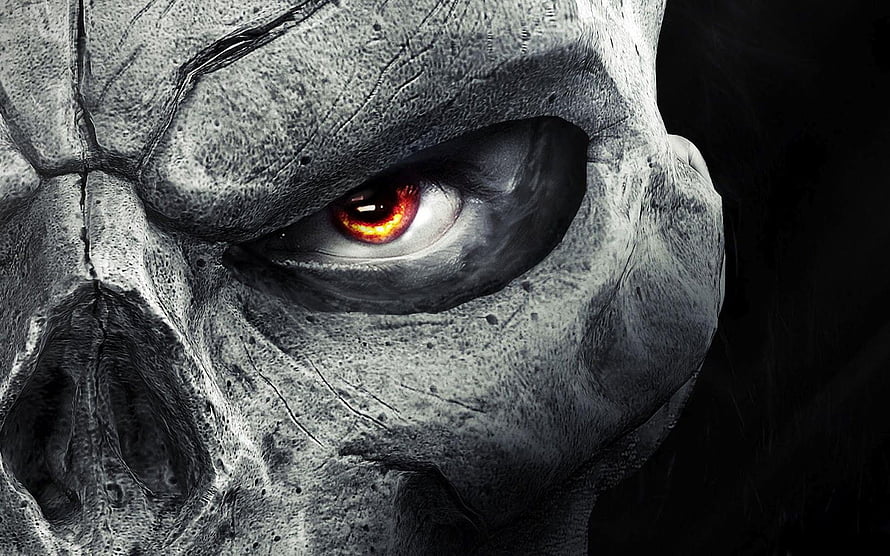 Close-Up of a Cracked Stone Skull with a Glowing Red Eye in Dark Fantasy Style HD wallpaper