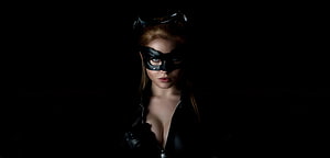 Catwoman Cosplay Portrait in Black Leather Mask and Goggles Against Dark Background HD wallpaper