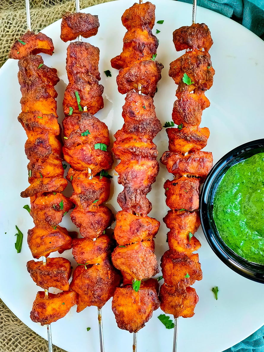 Baked Chicken Tandoori Tikka Skewers with Fresh Mint Chutney on a White Plate HD phone wallpaper