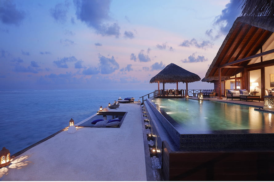 Luxury Overwater Villa with Infinity Pool at Dusk in French Polynesia HD wallpaper
