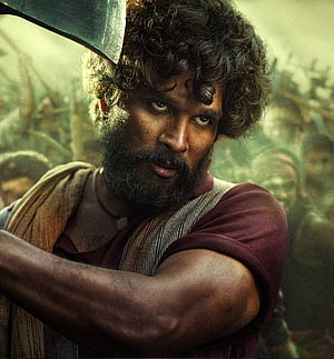 Allu Arjun as Pushpa in gritty period drama with intense close-up portrait HD phone wallpaper