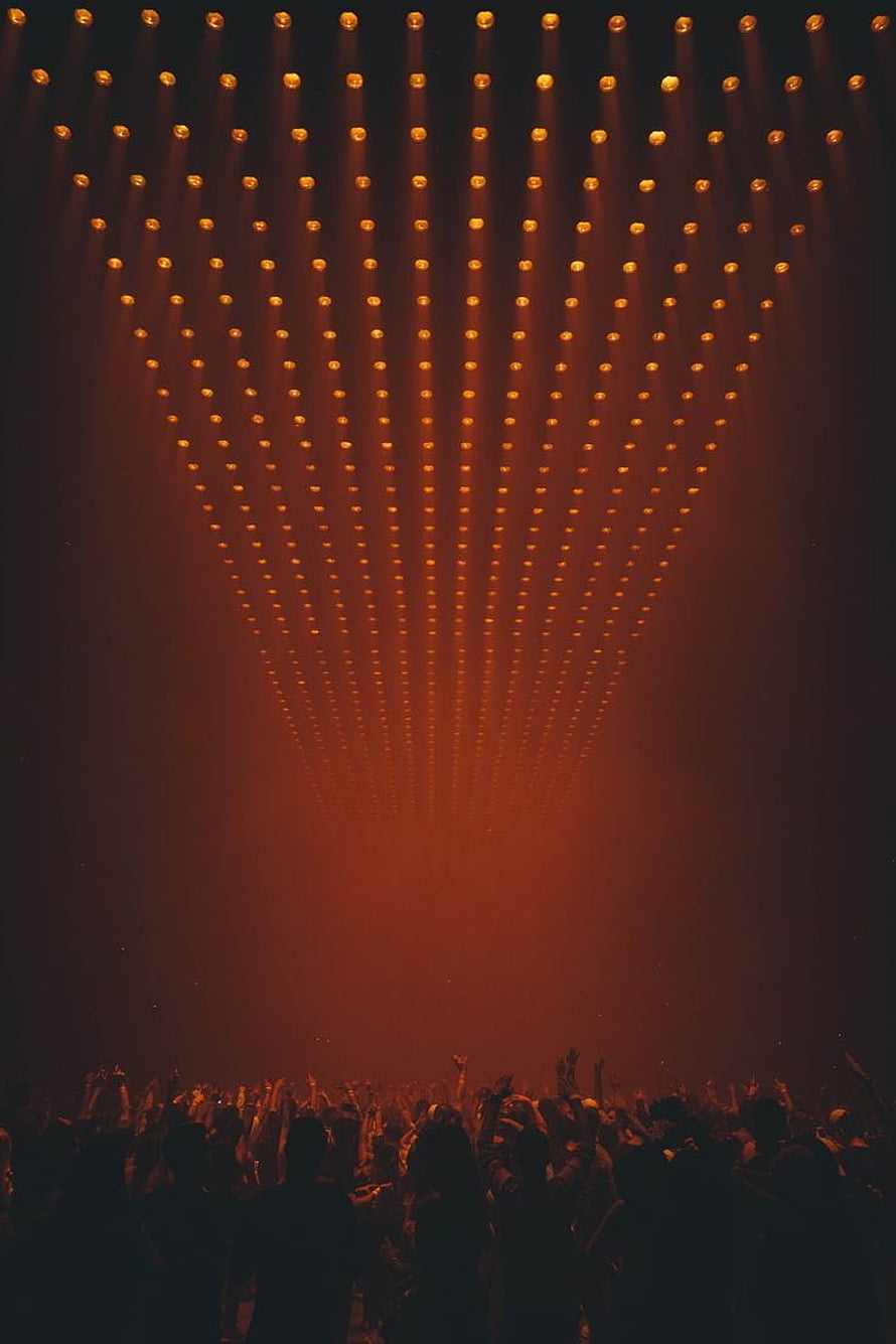 Dramatic Orange Stage Lighting Array Over Silhouetted Concert Audience HD phone wallpaper