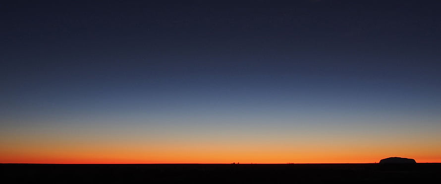 Minimalist Desert Horizon at Dusk with Vibrant Orange and Deep Blue Sky Gradient HD wallpaper