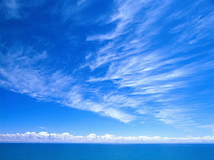 Serene Ocean Horizon Under a Vast Blue Sky with Wispy Cirrus Clouds and Cumulus Formations HD wallpaper