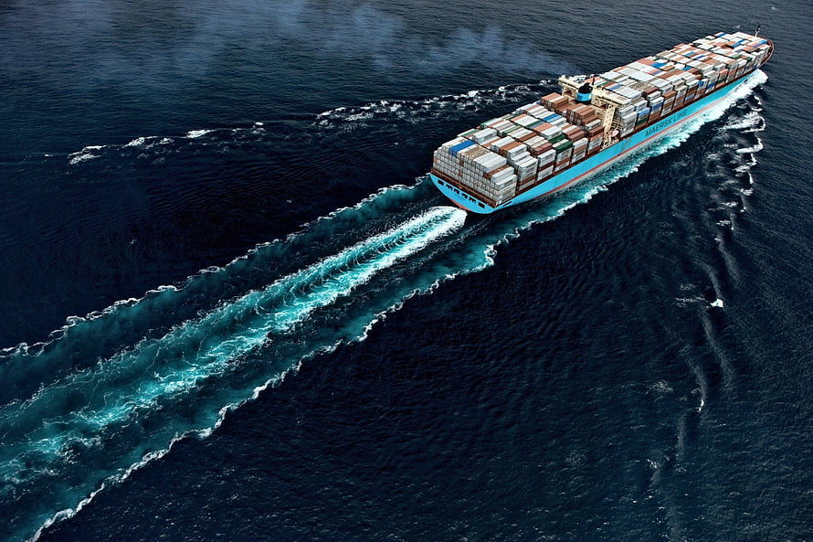 Aerial View of a Maersk Line Container Ship Cruising Through Deep Blue Ocean Waters HD wallpaper