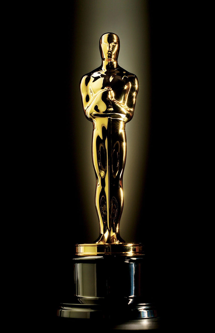 Golden Oscar Academy Award Trophy on a Reflective Black Surface HD phone wallpaper