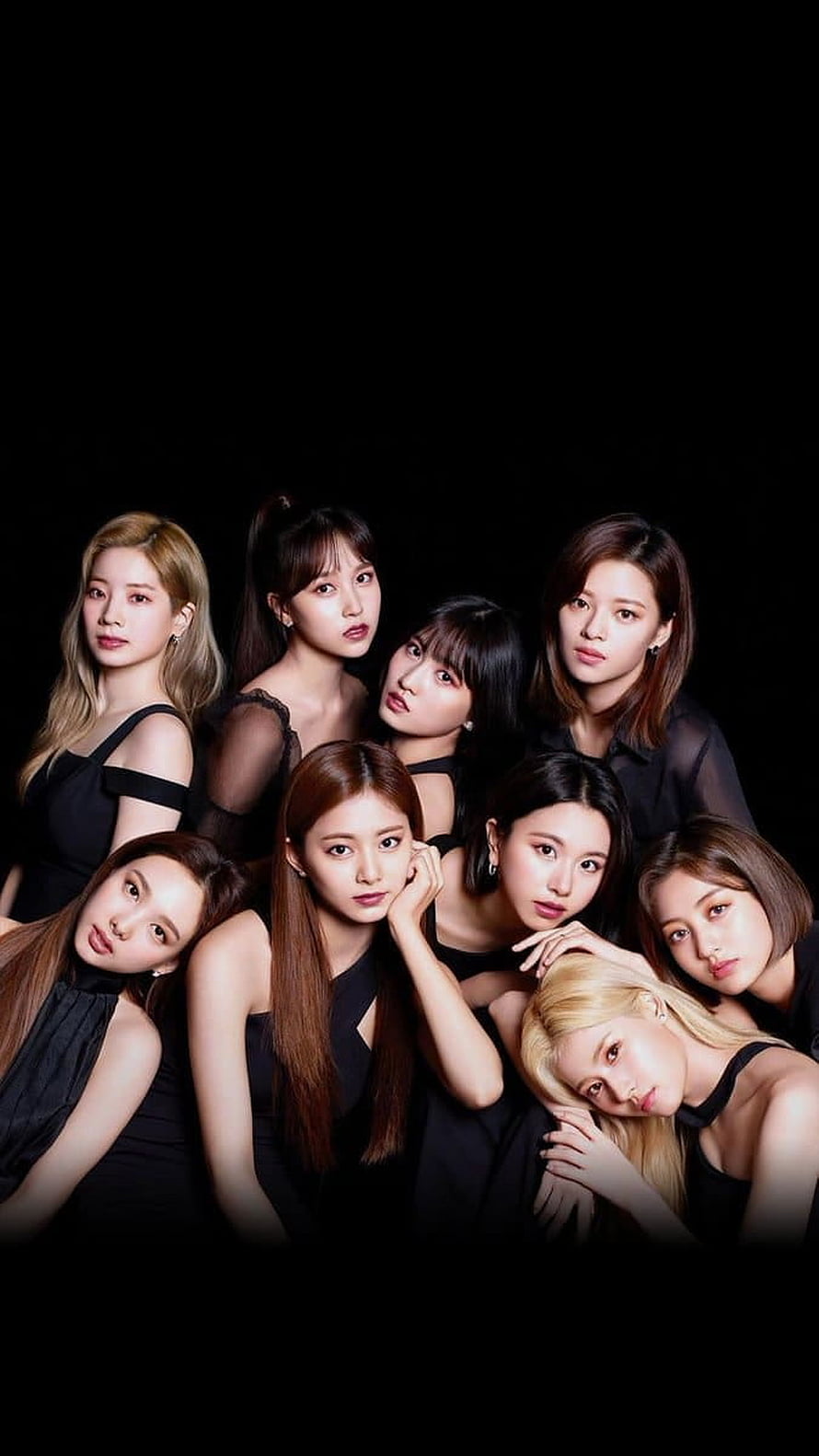 Twice Group Portrait in Black Attire Against Dark Background HD phone wallpaper