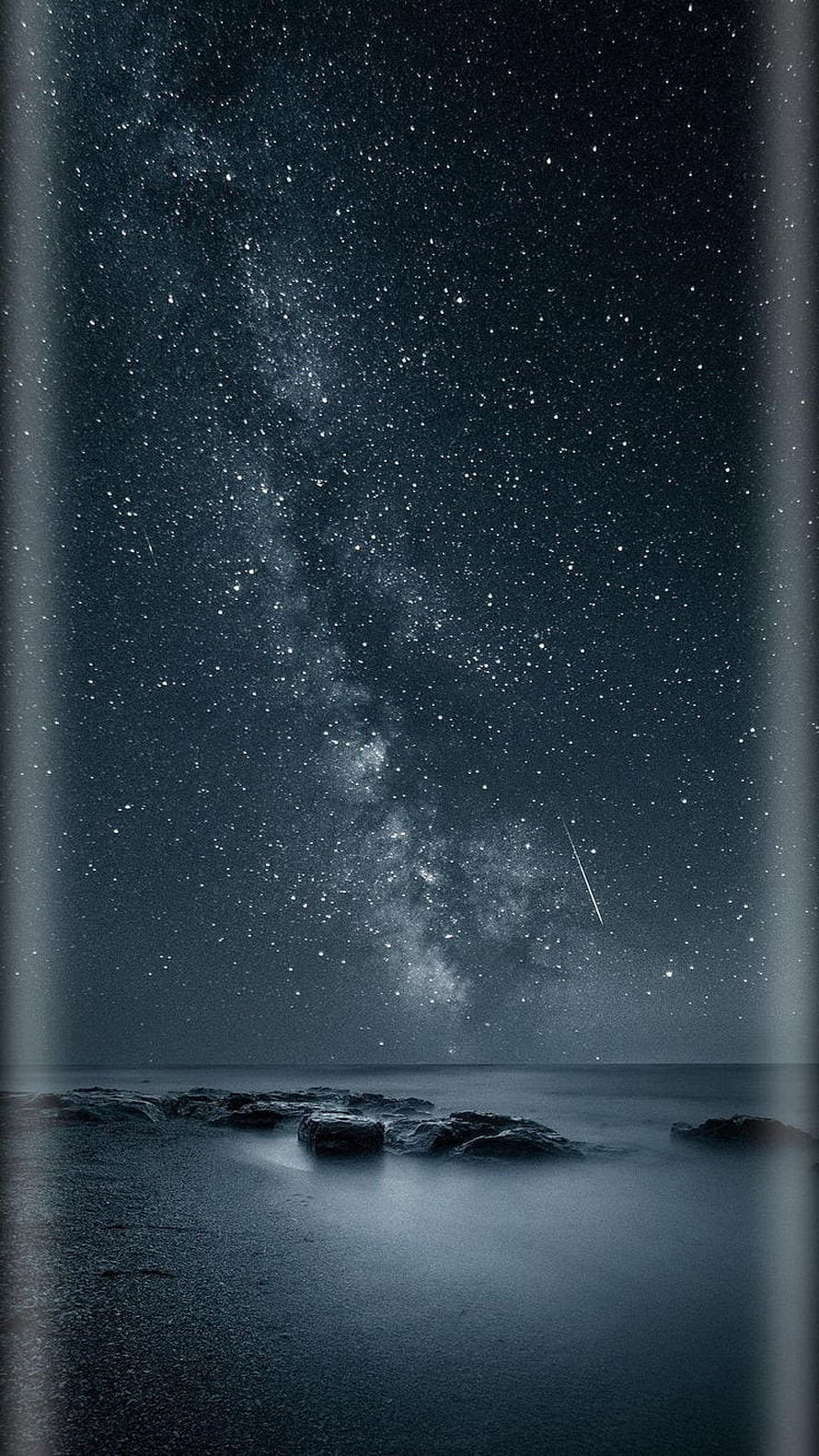 Milky Way Galaxy Over a Dark Ocean Shore with Shooting Star and Rocky Coastline HD phone wallpaper