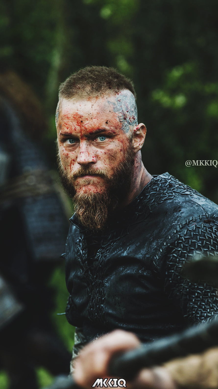 Ragnar Lothbrok in Chainmail Armor with Bloodied Face and Intense Blue Eyes HD phone wallpaper