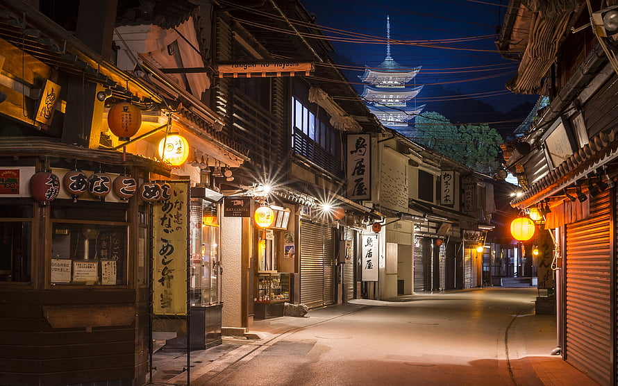 Miyajima Night Street in Japan with Traditional Lanterns and Pagoda HD wallpaper