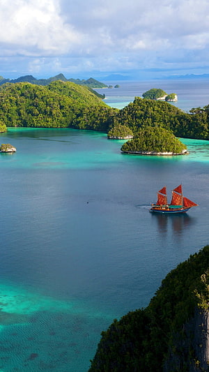 Traditional Sailboat Cruising Turquoise Waters of Indonesia's Tropical Island Archipelago HD phone wallpaper