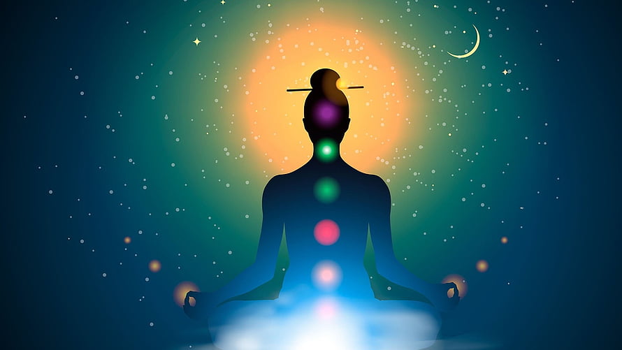 Silhouette of a Meditating Figure with Seven Glowing Chakra Points Against a Starry Night Sky HD wallpaper