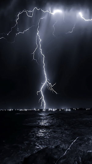 Dramatic Night Lightning Strike Over Dark Water Surface HD phone wallpaper