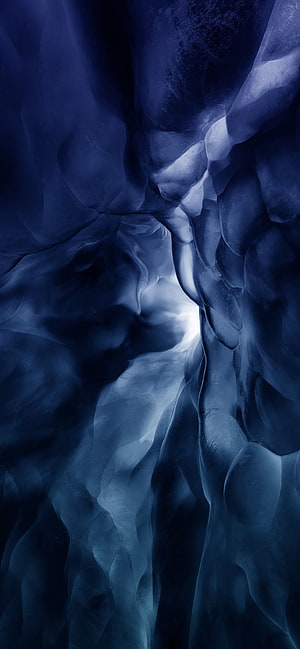 Deep Blue Ice Cave Interior with Ethereal Light and Smooth Frozen Walls HD phone wallpaper