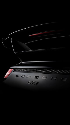 Porsche GT3 Rear Spoiler and Badge Detail in Dramatic Black Lighting HD phone wallpaper