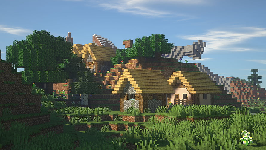 Minecraft Village Landscape with Thatched Roofs and Lush Greenery HD wallpaper