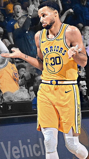 Stephen Curry in Golden State Warriors yellow jersey on the basketball court HD phone wallpaper