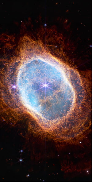 Vibrant Ring Nebula with Blue Core and Orange Gas Clouds in Deep Space HD phone wallpaper