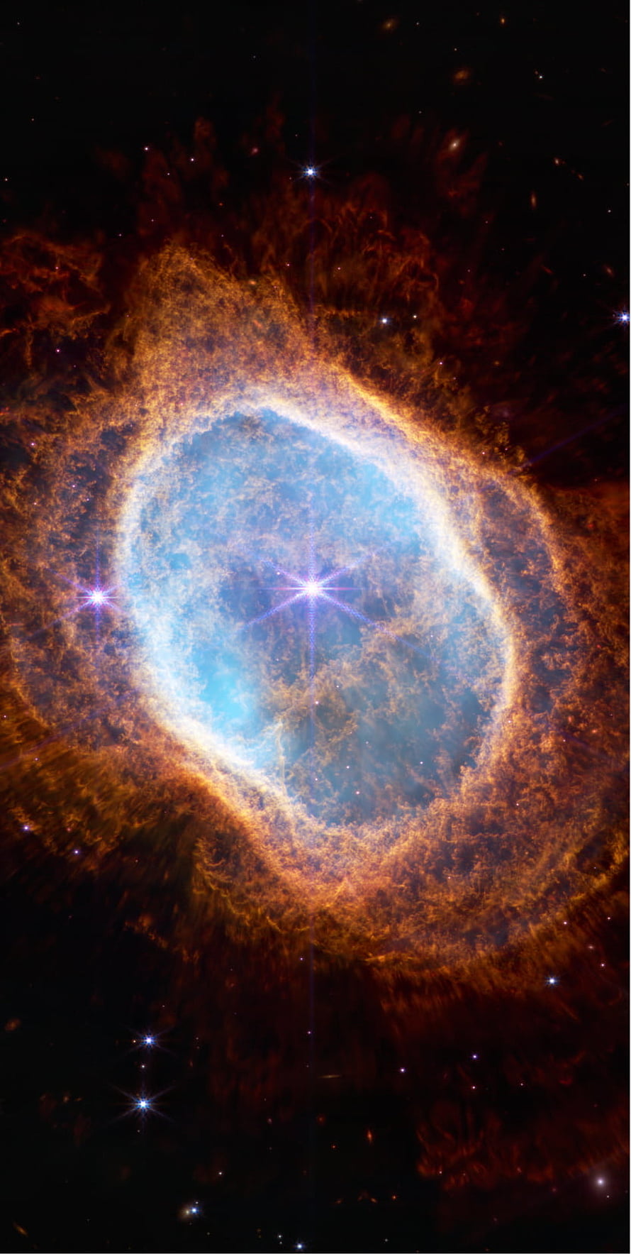 Vibrant Ring Nebula with Blue Core and Orange Gas Clouds in Deep Space HD phone wallpaper