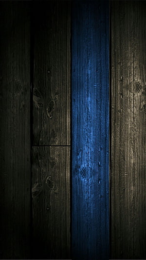 Dark rustic wood planks with a glowing blue vertical accent line HD phone wallpaper