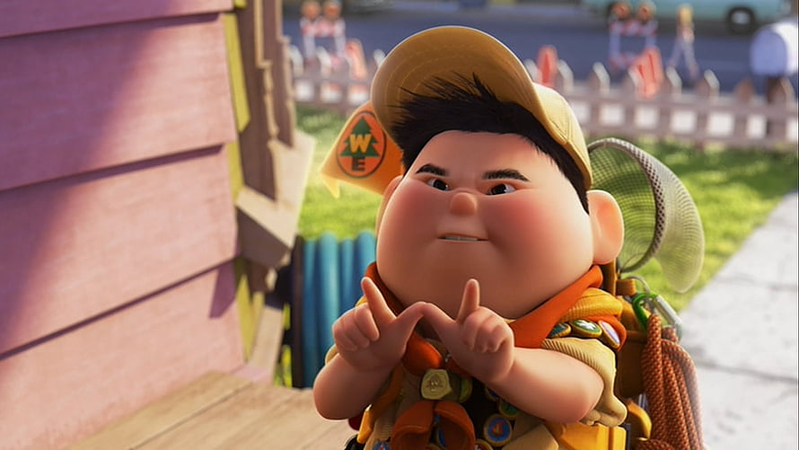 Russell from Disney Pixar Up in Boy Scout Uniform Making a Heart Gesture HD wallpaper