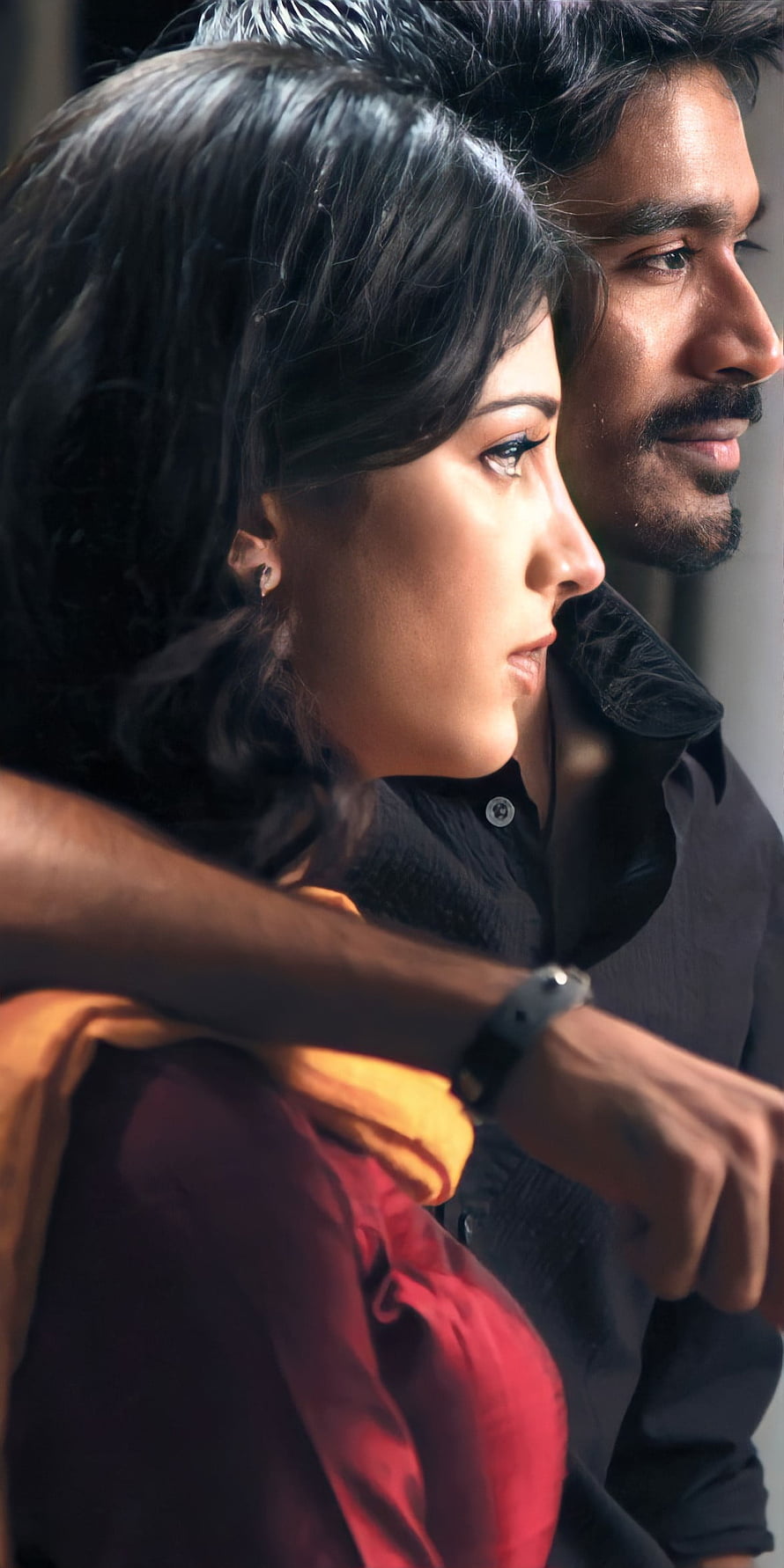 Dhanush and Actress in Intimate Profile Portrait with Warm Cinematic Lighting HD phone wallpaper