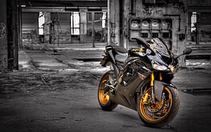 Kawasaki ZX-6R sportbike with gold wheels parked in an abandoned industrial warehouse HD wallpaper