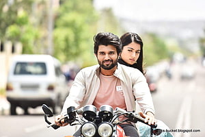 Vijay Deverakonda and Rashmika Mandanna riding a motorcycle in a romantic scene from Geetha Govindam HD wallpaper