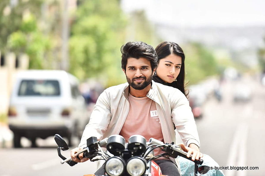 Vijay Deverakonda and Rashmika Mandanna riding a motorcycle in a romantic scene from Geetha Govindam HD wallpaper
