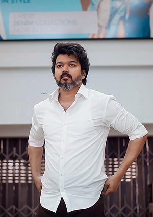 Thalapathy Vijay in White Shirt and Dark Trousers with Hands on Hips HD phone wallpaper