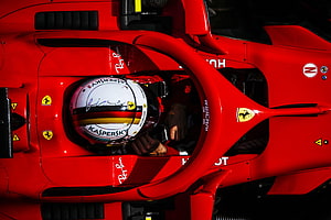 Sebastian Vettel in the Scuderia Ferrari SF71H Formula 1 Car Cockpit HD wallpaper