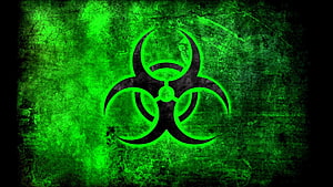 Glowing Green Biohazard Symbol on Dark Grunge Texture Background HD wallpaper