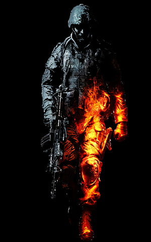 Flaming Soldier in Tactical Gear Holding Rifle Against Black Background HD phone wallpaper
