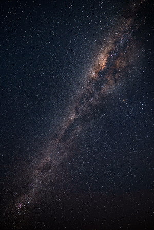 Milky Way Galaxy Arching Across a Deep Starry Night Sky HD phone wallpaper