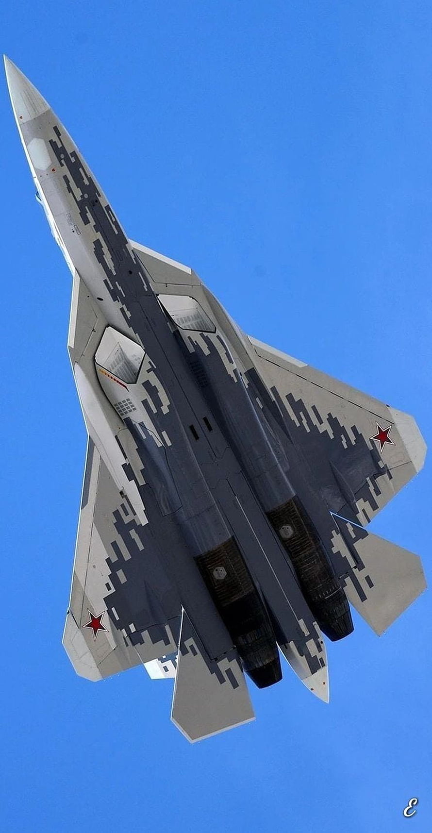 Sukhoi Su-57 Stealth Fighter Jet in Digital Camouflage Against Clear Blue Sky HD phone wallpaper