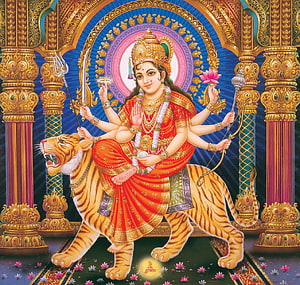 Goddess Durga Riding a Tiger in Traditional Indian Temple Art HD wallpaper