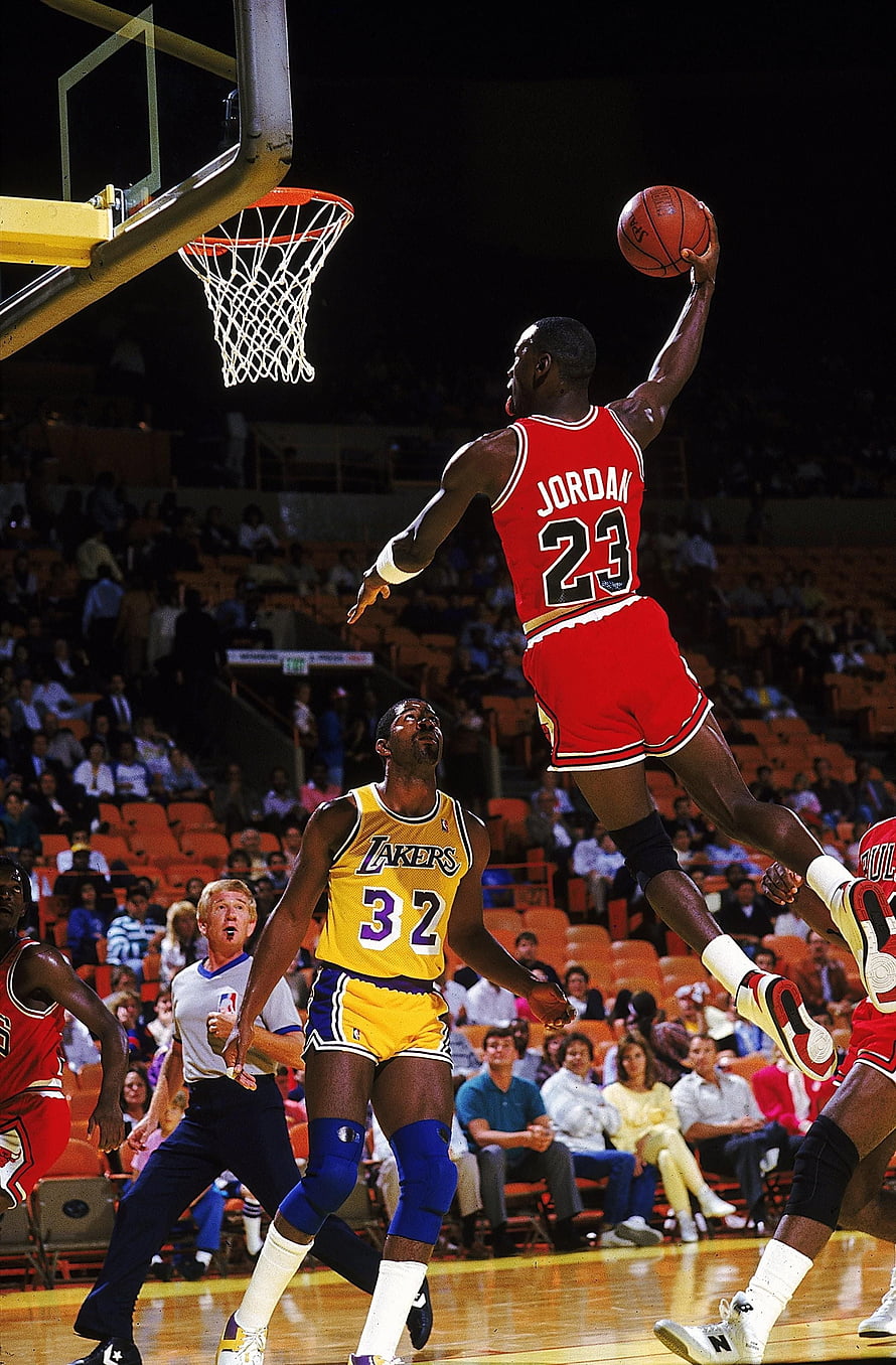 Michael Jordan in mid-air dunk against the Lakers during an NBA game HD phone wallpaper