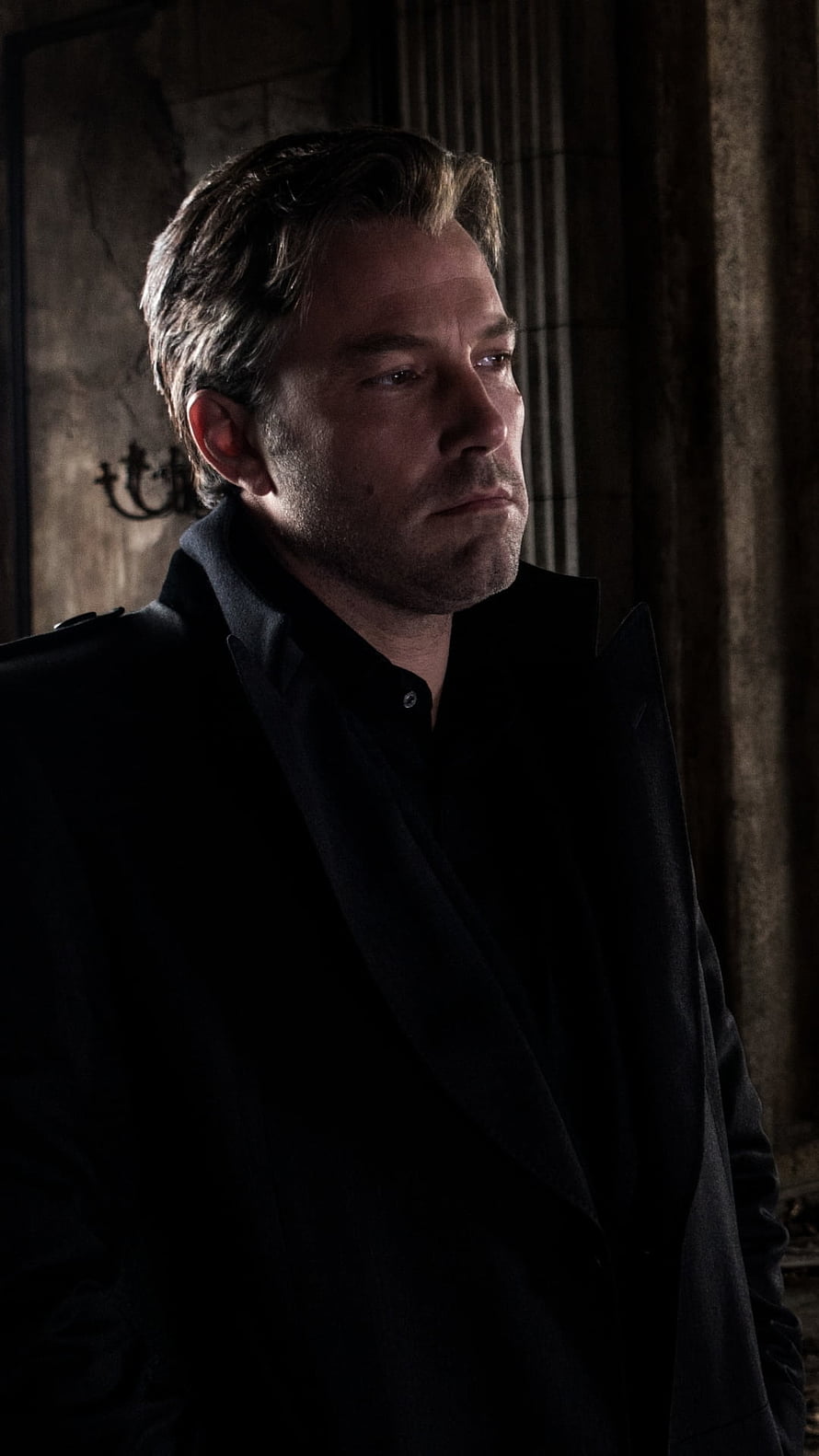 Ben Affleck as Bruce Wayne in a dark cinematic portrait wearing a black coat HD phone wallpaper