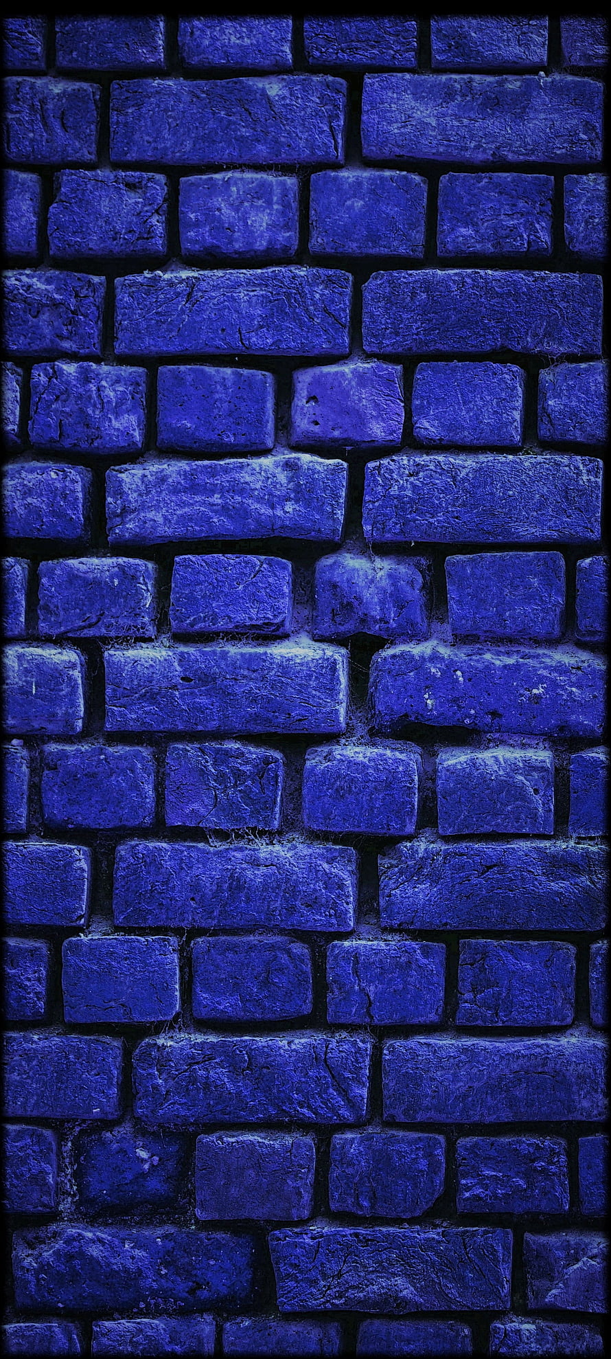 Deep Blue Brick Wall Texture with Dramatic Lighting and Rugged Surface Detail HD phone wallpaper
