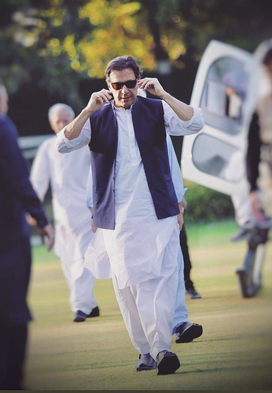 Imran Khan Walking in Traditional White Shalwar Kameez and Navy Waistcoat HD phone wallpaper