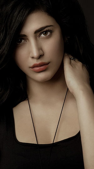 Shruti Hassan moody studio portrait with dark hair and black top HD phone wallpaper